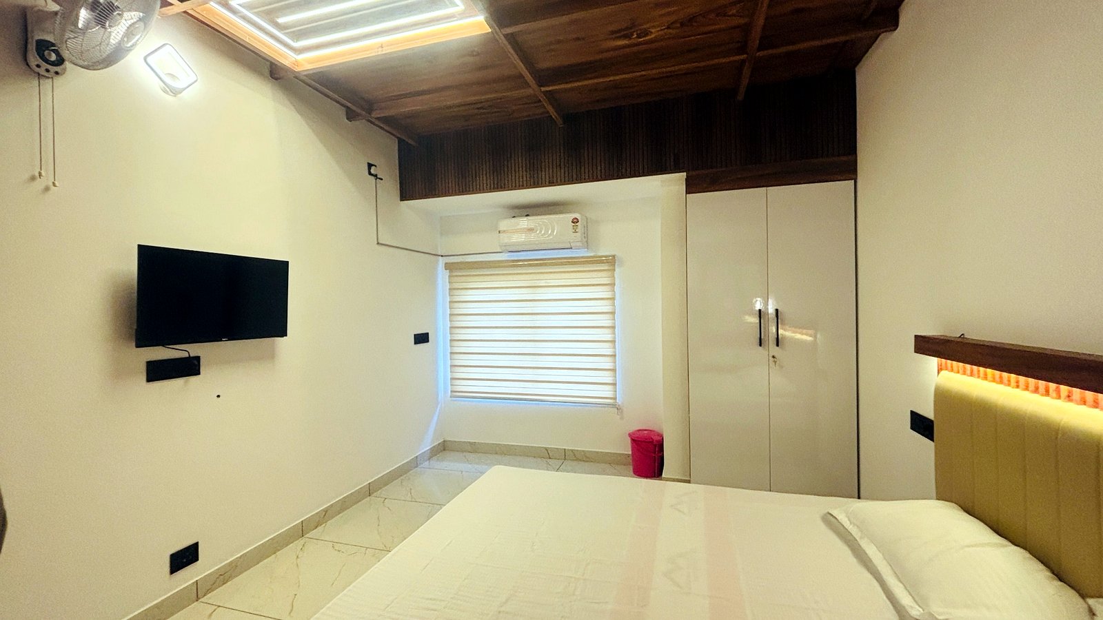 Kerala Spices Homestay room with TV wardrobes and AC